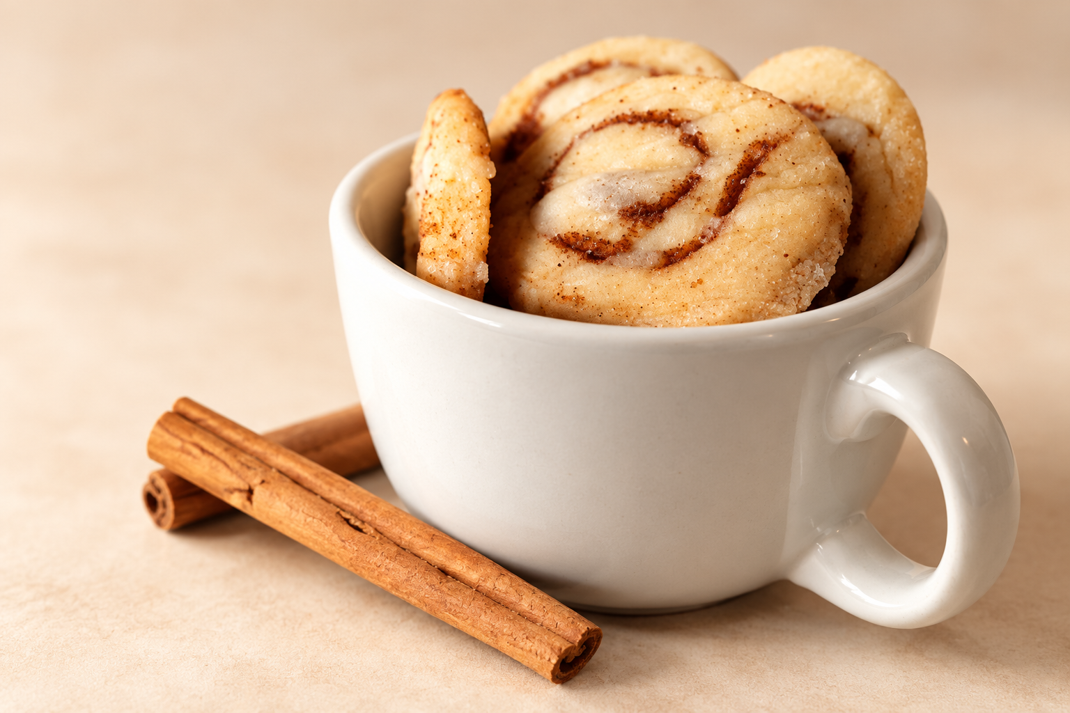 Cinnamon swirl cookies nestled in a ceramic mug