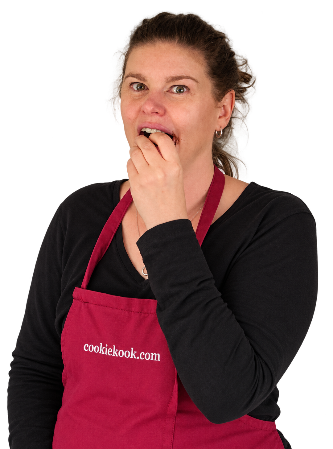 Sher tasting a treat, wearing her Cookie Kook apron